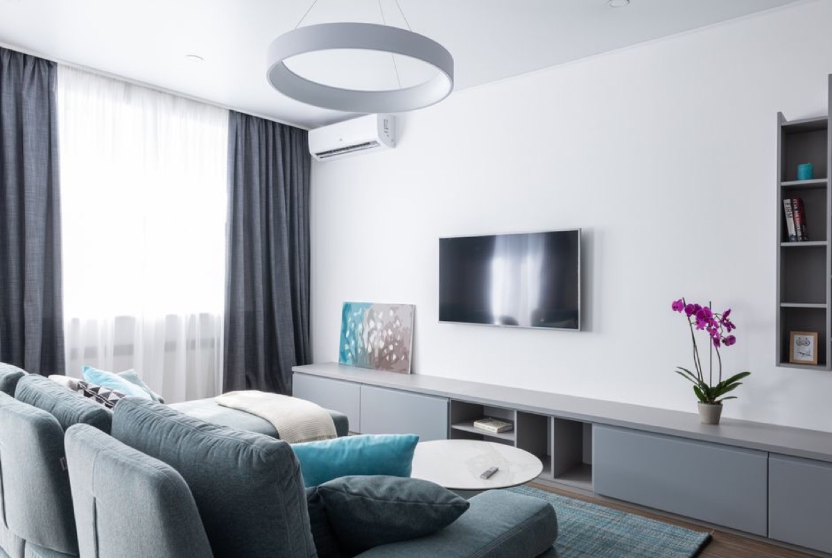Sleek modern living room where air purifier performance and coverage matter for the whole space