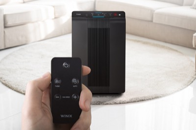 Winix air purifier unit in a living room, same chassis and front panel as the Winix 5530