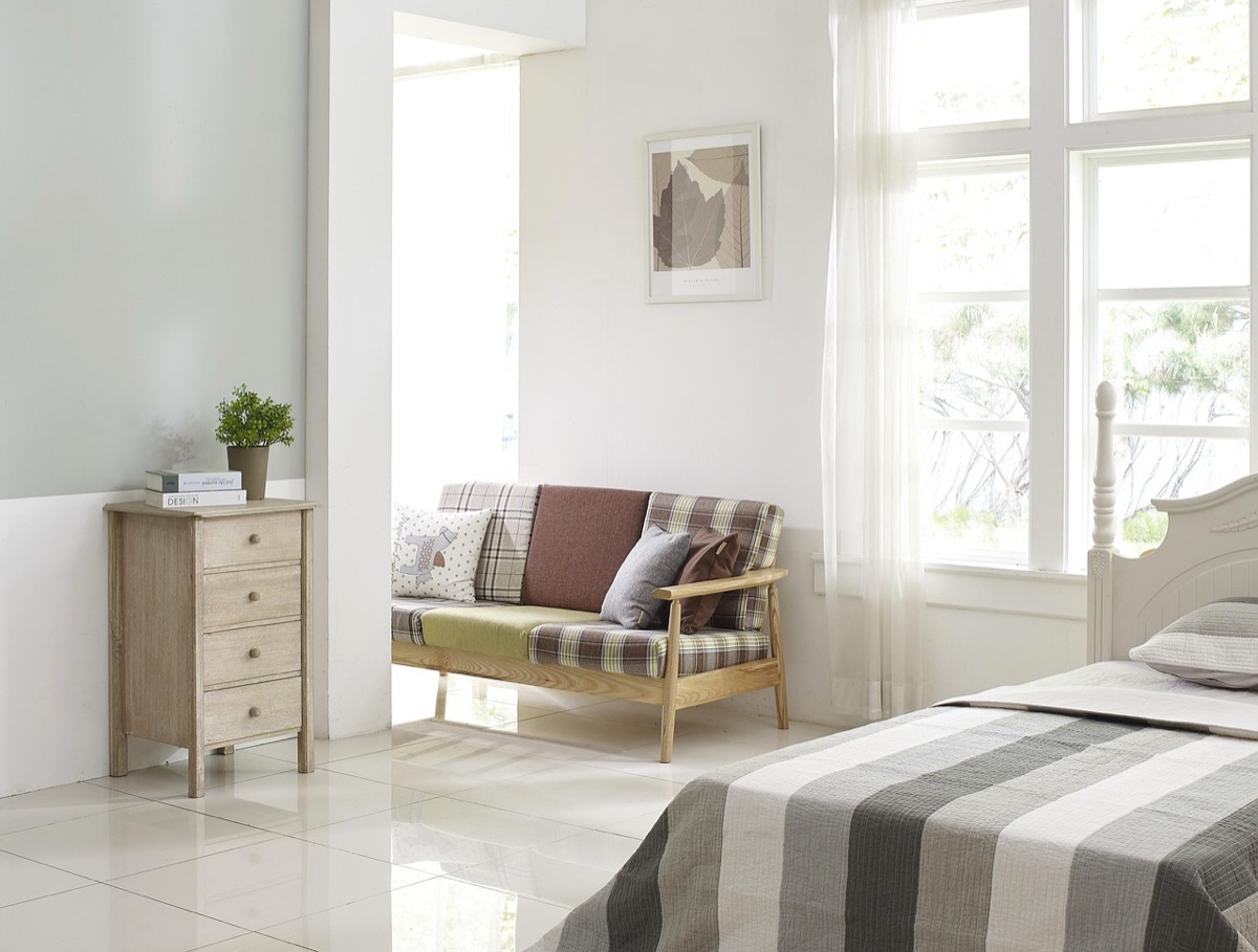 Peaceful bedroom nightstand with lamp and plant